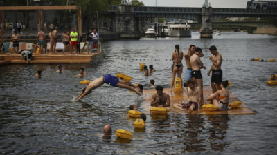 A century after ban, how Paris cleaned Seine river for swimming and how Olympics helped