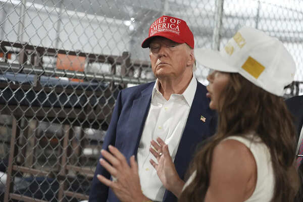 Photos of Trump touring an immigration detention center dubbed 'Alligator Alcatraz'