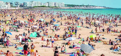 A French beach town's plea to tourists: Keep your clothes on in markets