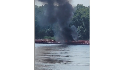 Smoke fills the air from a barge after a helicopter crash in the Mississippi River near Alton, Ill (Image credits: AP) Mississippi crash: Two dead after helicopter crashes into barge on river; FAA, NTSB to investigate
