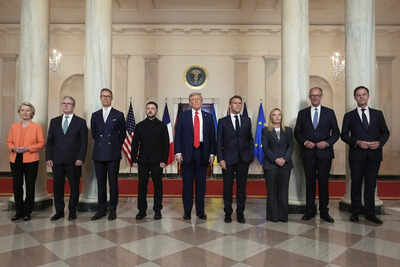 European Commission President Ursula von der Leyen, from left, British Prime Minister Keir Starmer, Finland's President Alexander Stubb, Ukrainian President Volodymyr Zelenskyy, President Donald Trump, France's President Emmanuel Macron, Italy's Prime Minister Giorgia Meloni, Germany's Chancellor Friedrich Merz and NATO Secretary General Mark Rutte pose for a group photo in the Grand Foyer of the White House, in Washington. (AP/PTI)(AP08_19_2025_000005B) Russia-Ukraine War: How Trump's MAGA allies are reacting to Zelenskyy reset