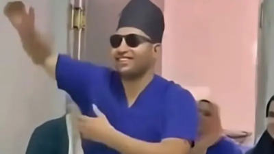 A viral video showing an Egyptian doctor dancing with a newborn by the neck has triggered public outrage and official investigation/Image: X Egyptian doctor filmed dancing with newborn sparks outrage, faces professional ethics probe