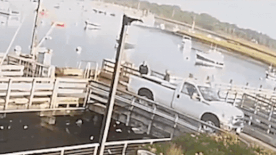 Watch: Massachusetts teen reverses pickup and plunges off pier; narrowly misses father’s boat