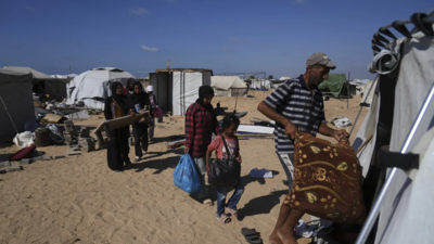 The Abu Jarad family moves their belongings into a newly built tent in Khan Younis (Imagw credits: AP) Despair deepens for Palestinian family forced to flee across Gaza yet again