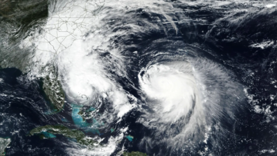 Tropical Storm Imelda on left and Hurricane Humberto on right, in the Atlantic Ocean (Image Credits: AP) 2 killed in Cuba as Tropical Storm Imelda and Hurricane Humberto threaten Bahamas and Bermuda