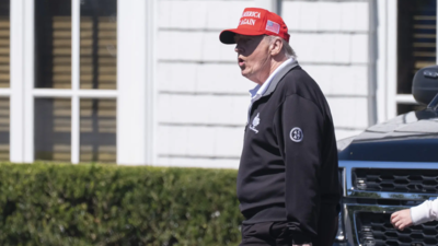 US President Donald Trump walks at the Trump National Golf Club in Sterling. (Pic credit: AP) 'Never felt better': Donald Trump shuts down health rumours? Asks 'are you better off?'