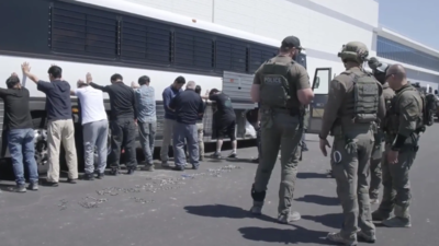 This image from video provided by US Immigration and Customs Enforcement via DVIDS shows manufacturing plant employees waiting to have their legs shackled at the Hyundai Motor Group’s electric vehicle plant. (Pic credit: AP) What happened during US raid on Hyundai's plant? Workers hid in air ducts, plunged into pond; 475 Koreans arrested - inside the chaos