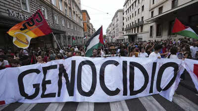 People hold a banner reading Pro-Palestinian strikes, blockades across Italy