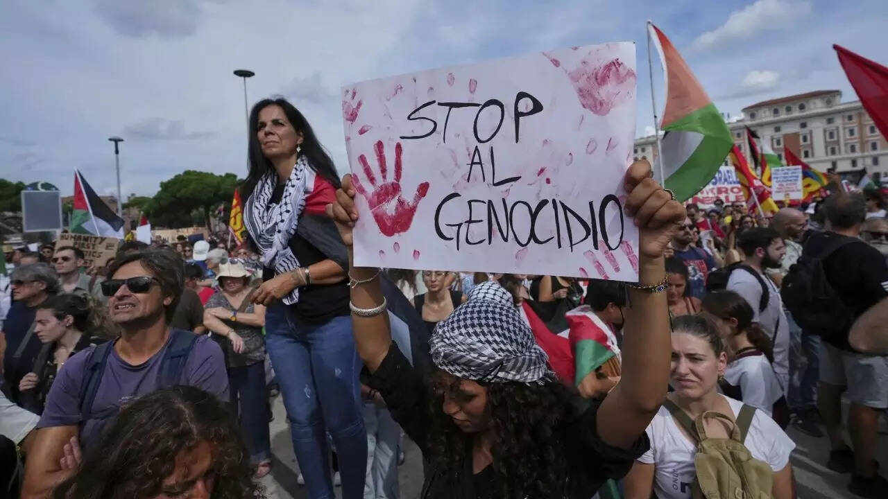 People hold banners reading People hold banners reading