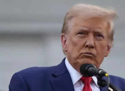 US president Donald Trump (AP photo) '100% tariff': US official says Trump proposed higher duties on Russian oil buyers India, China in EU talks - Report