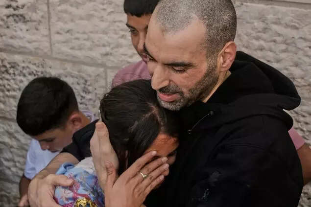 A Palestinian prisoner who was released from an Israeli prison as part of a ceasefire deal between Israel and Hamas, upon his arrival in the West Bank city of Ramallah (AP photo)