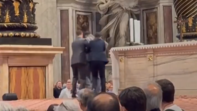 Man escorted by security (X/@breeadail) ‘This is vile’: Man exposes himself and urinates on altar in St Peter’s Basilica, leaves visitors ‘absolutely shocked, disgusted’