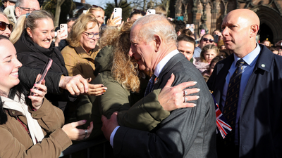 Britain's King Charles III embraces a well wisher, after his visit to Lichfield Cathedral, in Lichfield. (AP) 'How long have you known about Andrew and Epstein?': King Charles heckled outside Lichfield Cathedral — Watch
