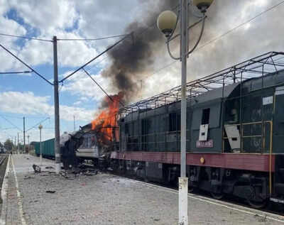 A passenger train is engulfed in flames following Russia's drone attack on a railway station in Shostka, Sumy region, Ukraine, Saturday, Oct. 4, 2025. (Ukrainian Railway via AP) Eight dead, dozens wounded as Russia strikes Ukraine's Odesa port