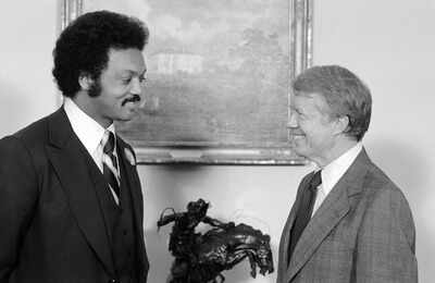 FILE - President Jimmy Carter speaks with the Rev. Jesse Jackson at the White House in Washington, April 4, 1979. (AP Photo/Bob Daugherty, File) Jesse Jackson walked, so Barack Obama could run