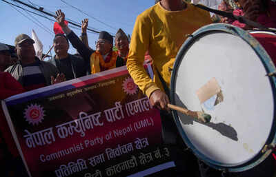 Rameshwor Phuyal, a candidate from the Communist Party of Nepal (Unified Marxist–Leninist), walks with supporters to the election office to register his candidacy for the general election to be held on March 5 in Kathmandu, Nepal, Tuesday, Jan. 20, 2026. (AP Photo/Niranjan Shrestha) Campaigning formally kicks off across Nepal for March 5 elections