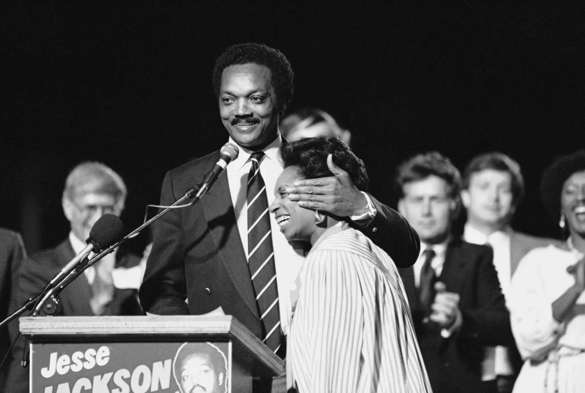 FILE - Democratic presidential candidate Jesse Jackson gives his wife Jacqueline a warm embrace as he takes time out from his political stumping in Los Angeles, May 18, 1984. (AP Photo/Lennox McLendon, File) Photos show the life of civil rights leader the Rev. Jesse Jackson