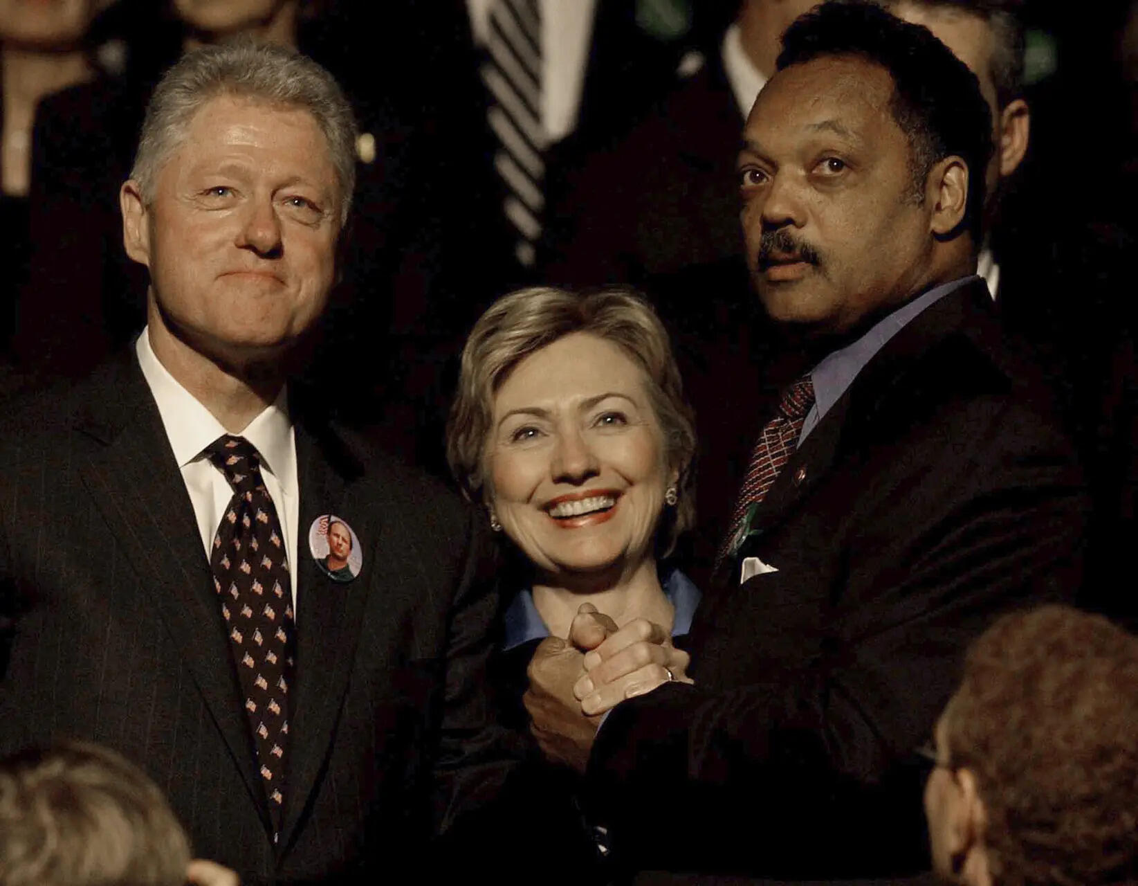 FILE - Former President Bill Clinton and his wife, U.S. Sen. Hillary Rodham Clinton, greet Jesse Jackson before a public memorial service, Oct. 29, 2002, in Minneapolis for U.S. Sen. Paul Wellstone, his wife, daughter and three staff members who died in a plane crash. (AP Photo/Stacy Wescott, Pool, File) Photos show the life of civil rights leader the Rev. Jesse Jackson