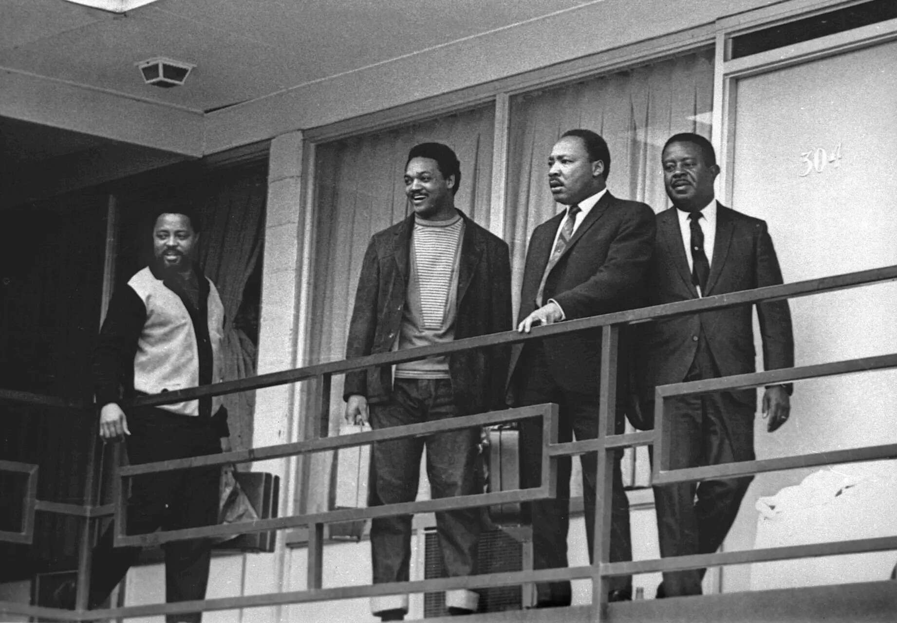 FILE - Rev. Martin Luther King Jr., second from right, stands with Hosea Williams, left, Jesse Jackson, second from left, and Ralph Abernathy, right, on the balcony of the Lorraine Motel in Memphis, Tenn., a day before he was assassinated at approximately the same place, April 3, 1968. (AP Photo/Charles Kelly, File) Photos show the life of civil rights leader the Rev. Jesse Jackson