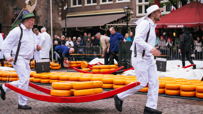 The Cheese ritual: Inside the 660-year-old Dutch market where men in white race with giant cheese wheels