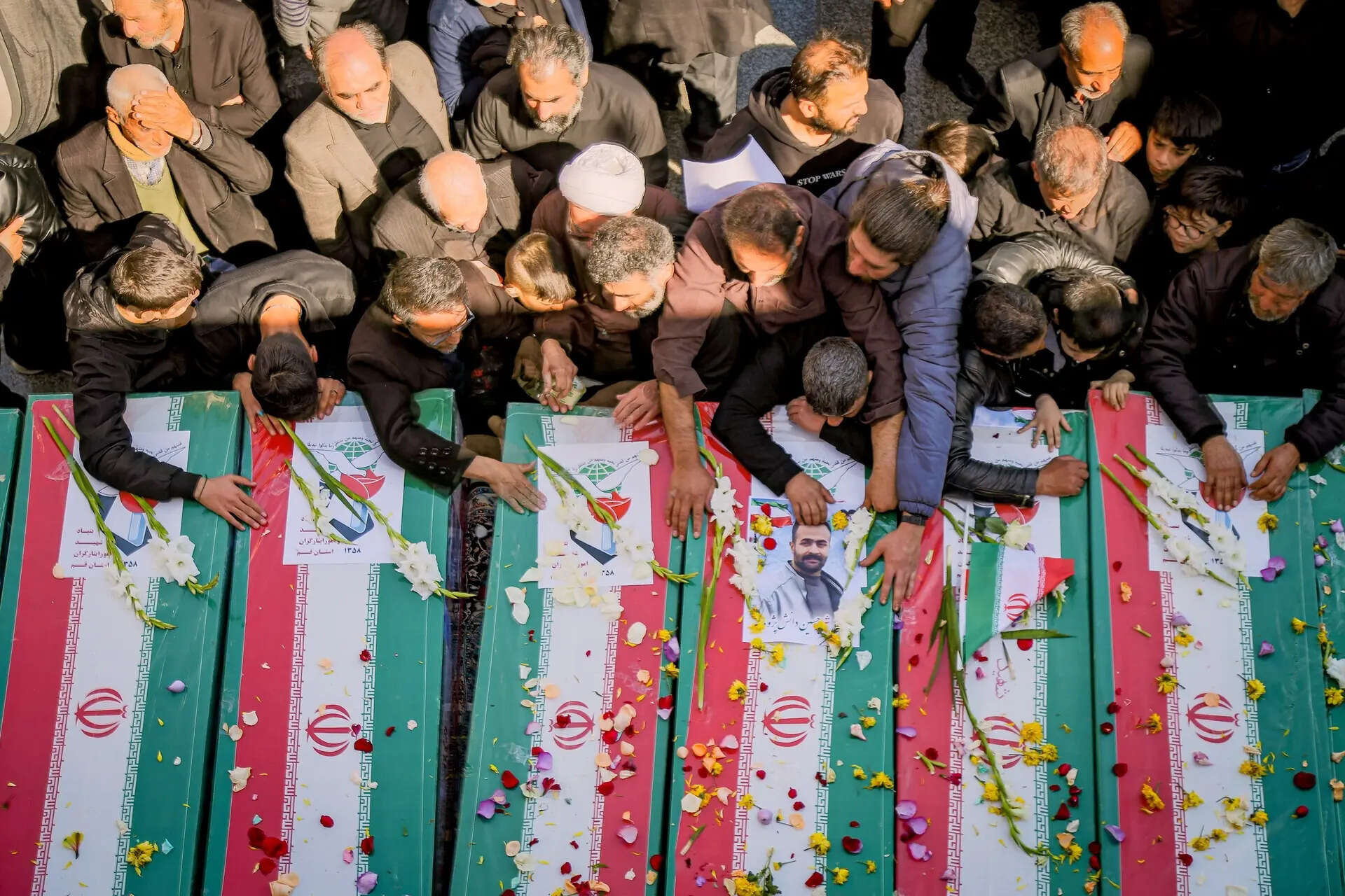 Mourners reach out to coffins during a funeral for people killed during the ongoing U.S.–Israeli military campaign in Qom, Iran, Thursday, March 5, 2026. (Seyyed Mehdi Alavi/ISNA via AP) The Latest: Trump calls for Iran’s ‘unconditional surrender’ as Israel strikes Lebanon