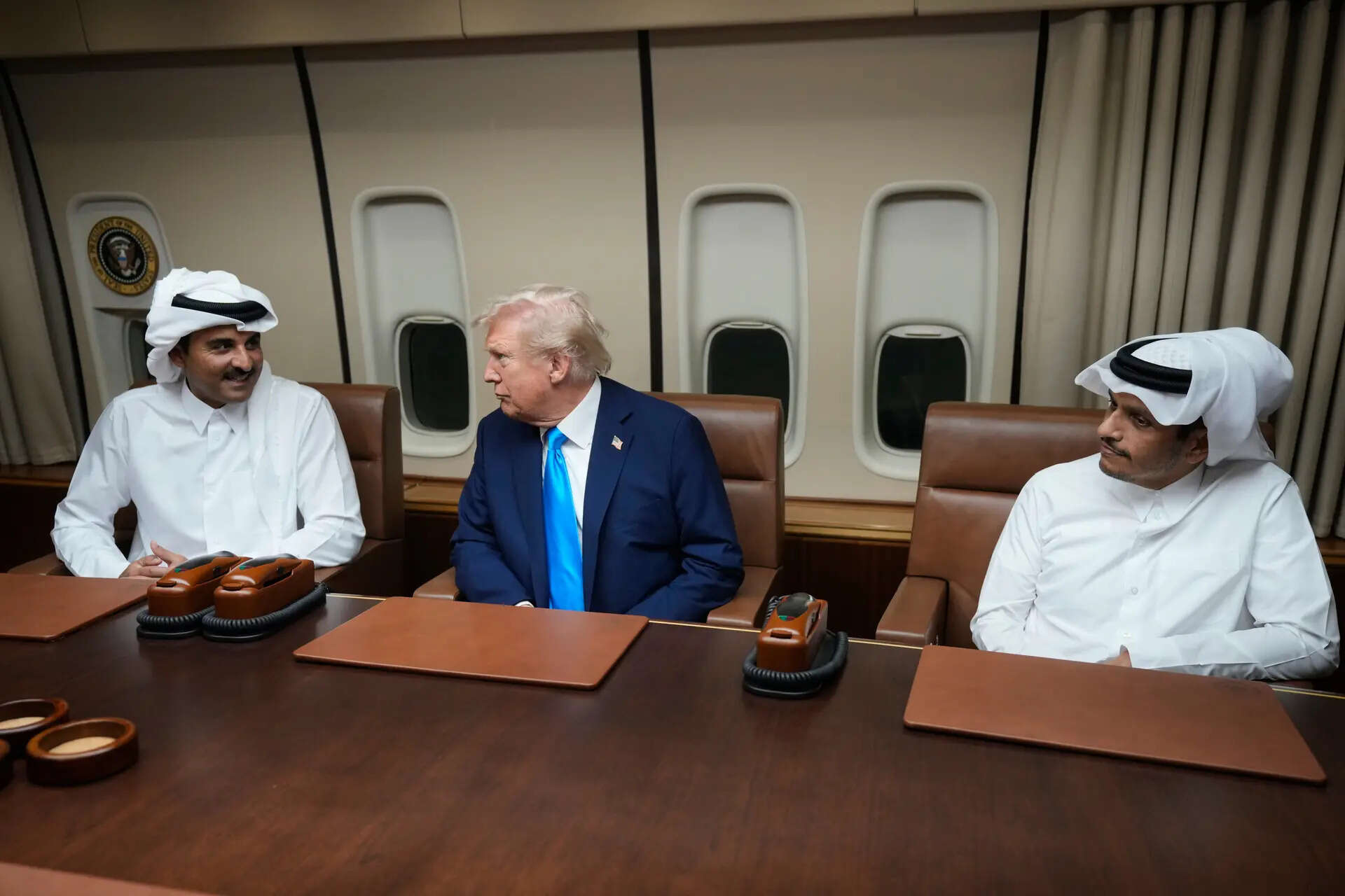 President Donald Trump, center, meets with Emir of Qatar Sheikh Tamim bin Hamad al-Thani, left, and Qatar Prime Minister and Foreign Minister Sheikh Mohammed bin Abdulrahman bin Jassim Al Thani aboard Air Force One at Al Udeid Air Base in Doha, Qatar, Saturday, Oct. 25, 2025. (AP Photo/Mark Schiefelbein) The Qatar Conundrum