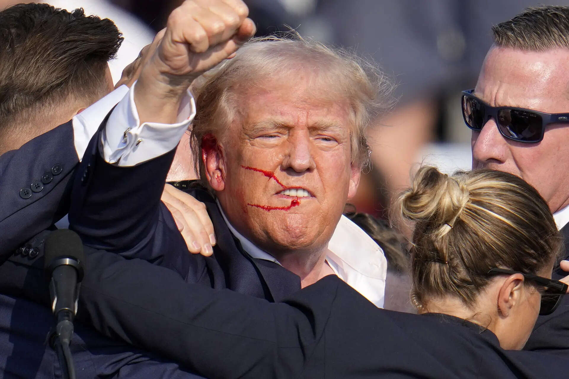 Donald Trump reacts following an assassination attempt at a campaign event in Butler in July, 2024 Trump returns to site of Pennsylvania assassination attempt for huge rally with Vance and Musk