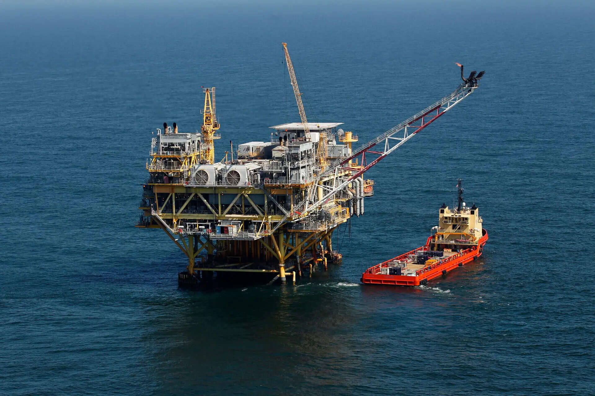 FILE - A supply vessel boat sits near an oil rig in the Gulf of Mexico, off the coast of Louisiana. April 10, 2011. (AP Photo/Gerald Herbert, File) Federal 'God squad' exempts oil and gas drilling in the Gulf from endangered species rules