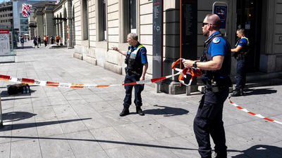 Police officers on scene after a stabbing attack at the train station in Winterthur, Switzerland 'Act of terror': Man stabs 3 at Swiss train station, arrested