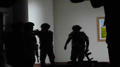 Philippine troopers exchange fire along a hallway at the Philippine Senate in Pasay, Philippines on Wednesday May 13, 2026. (AP Photo/Aaron Favila) Gunshots heard at Philippine Senate as Duterte aide, accused of crimes against humanity, tries to evade arrest for ICC trial - watch