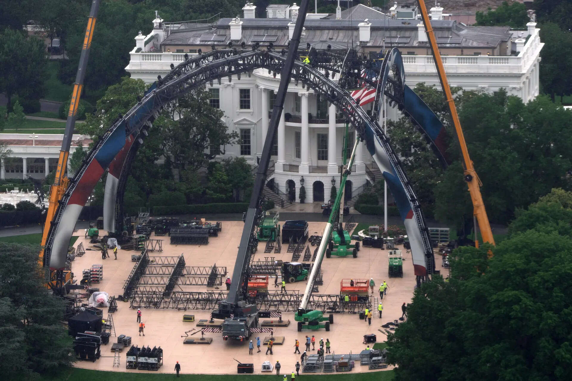 Equipment being placed on the South Lawn of the White House is seen from the Washington Monument, Tuesday, May 26, 2026, in Washington. The UFC is holding a mixed martial arts fight on June 14 as part of America 250 celebrations. (AP Photo/Mark Schiefelbein) The Latest: Trump convened his Cabinet as talks to end Iran war remain in flux
